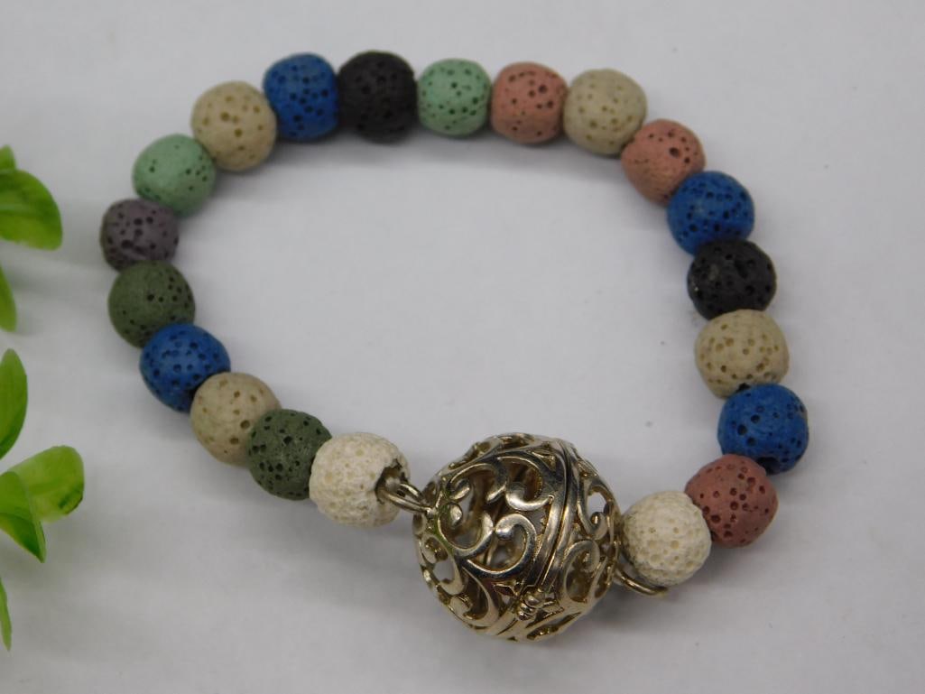 Multi-Colored Beaded Bracelet with Ornate Metal Accent: Multi-Colored Beaded Bracelet with Ornate Metal Accent