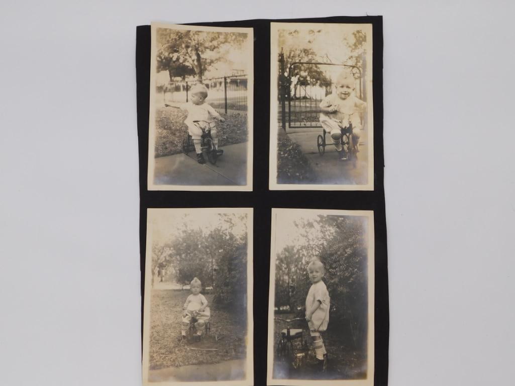 Antique Family Photograph Lot: A collection of eight sepia-toned vintage photographs mounted on black album pages depicting children on tricycles, a woman on a porch, and a landscape/canyon scene.