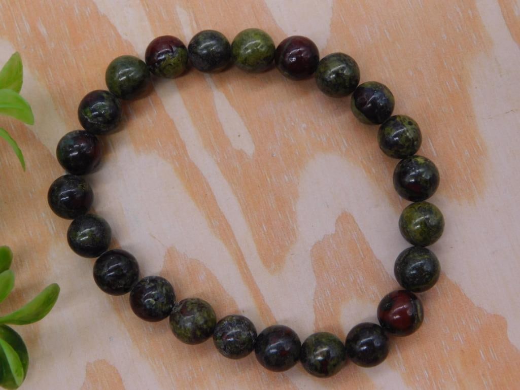Bloodstone Bead Stretch Bracelet: Round bead bloodstone gemstone stretch bracelet in dark green and red hues.