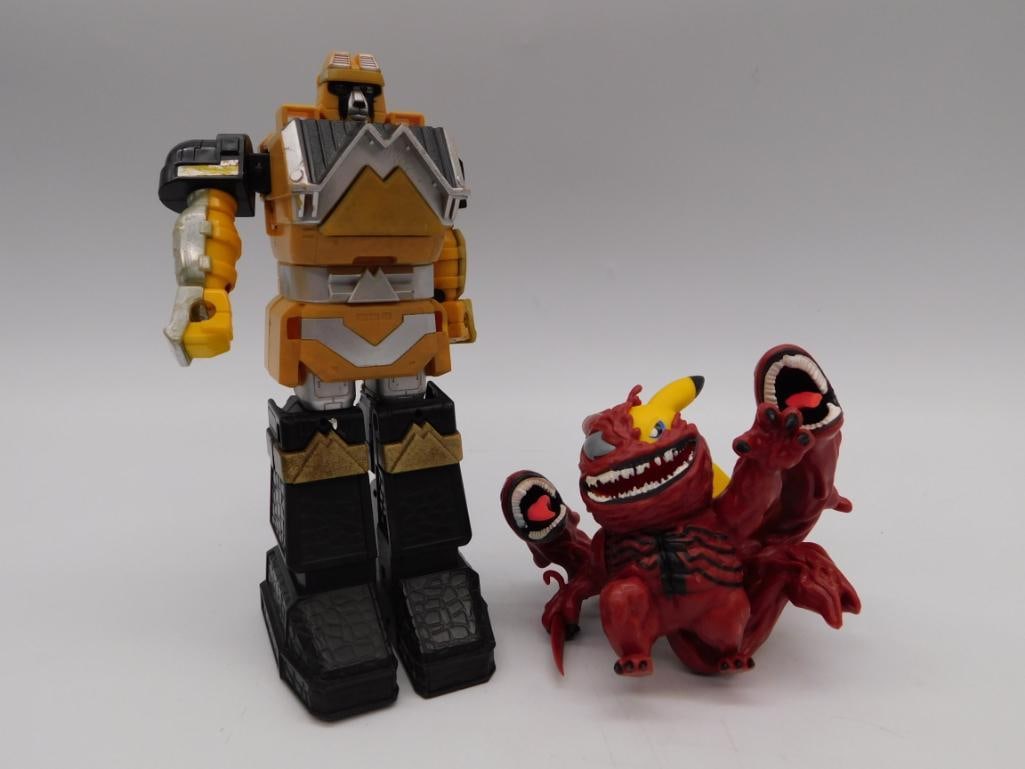 Power Rangers Zeo Megazord & Monster Figure Lot: Vintage Power Rangers Zeo Megazord action figure (orange, black, and silver, articulated arms and legs) paired with a red multi-armed monster figure with open-mouth claw hands. Megazord stands