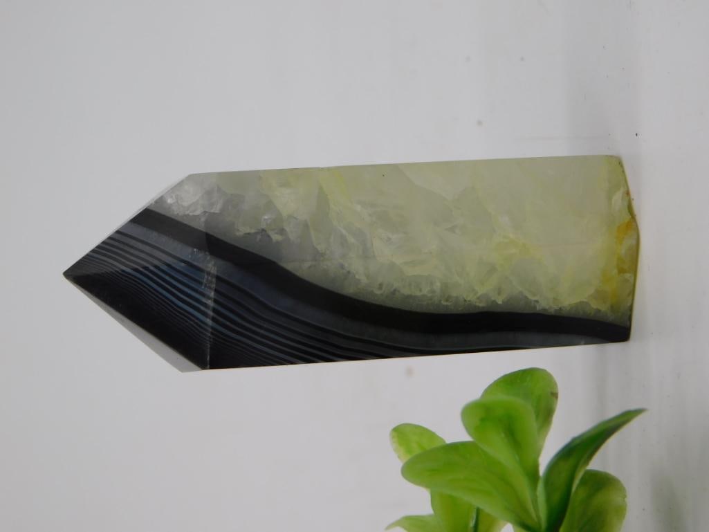 Polished Banded Agate Obelisk Point, Black & Gray: Natural agate crystal point/obelisk with striking black and gray banding and a clear quartz crown at the tip. Polished finish, weighs 53 grams and measures approximately 4 inches long.
