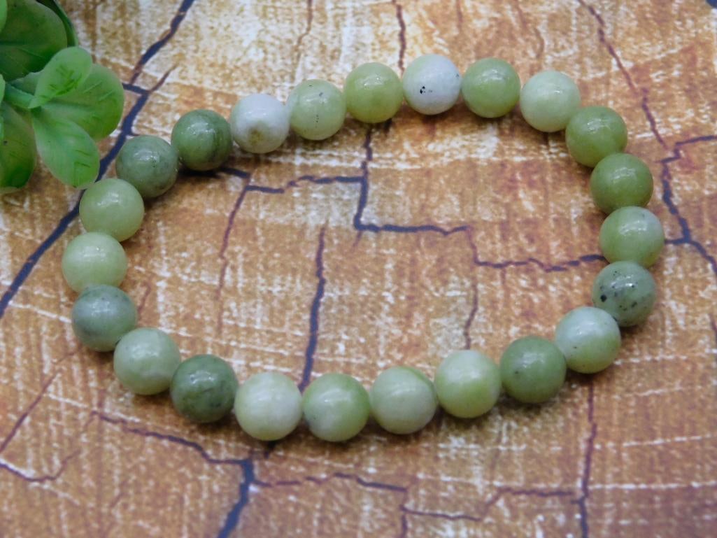 Green Jade-Style Beaded Stretch Bracelet: Stretch bracelet strung with round green and white jade-look mineral beads. No clasp, elastic pull-on style. Approximately 7 inches around, beads roughly 8mm each.