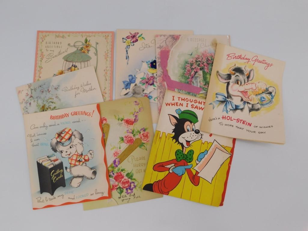 Vintage Greeting Card Ephemera Lot: A grouping of eight vintage greeting cards including birthday and April Fool's designs with whimsical illustrations of animals, flowers, and cartoon characters.