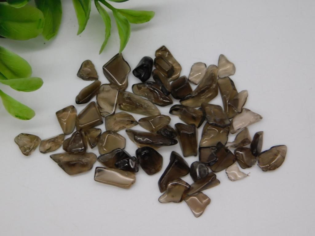 Loose Smoky Quartz Tumbled Gemstone Lot: A lot of 40+ small tumbled smoky quartz stones in varying brown and translucent tones, labeled Smokey Qtz 12oz.