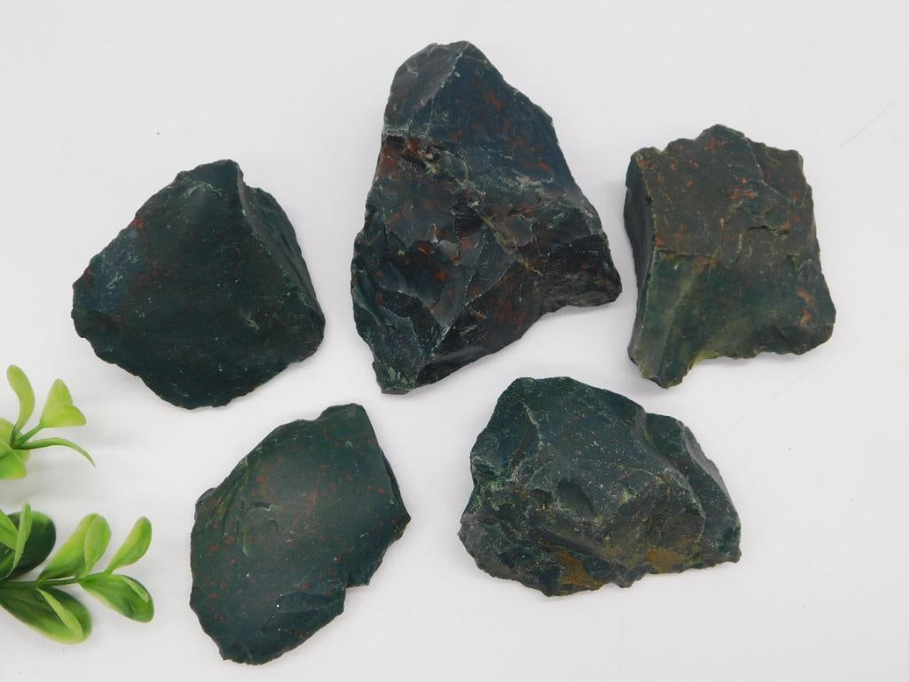 Rough Bloodstone Rock Lot: Five rough, unpolished pieces of dark green bloodstone with red/orange jasper inclusions. Weighs 1 lb 1 oz.