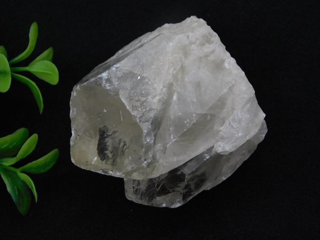 Natural Quartz Crystal Cluster: A rough, translucent smoky-white quartz crystal formation with well-defined faceted crystal faces. 143 grams.
