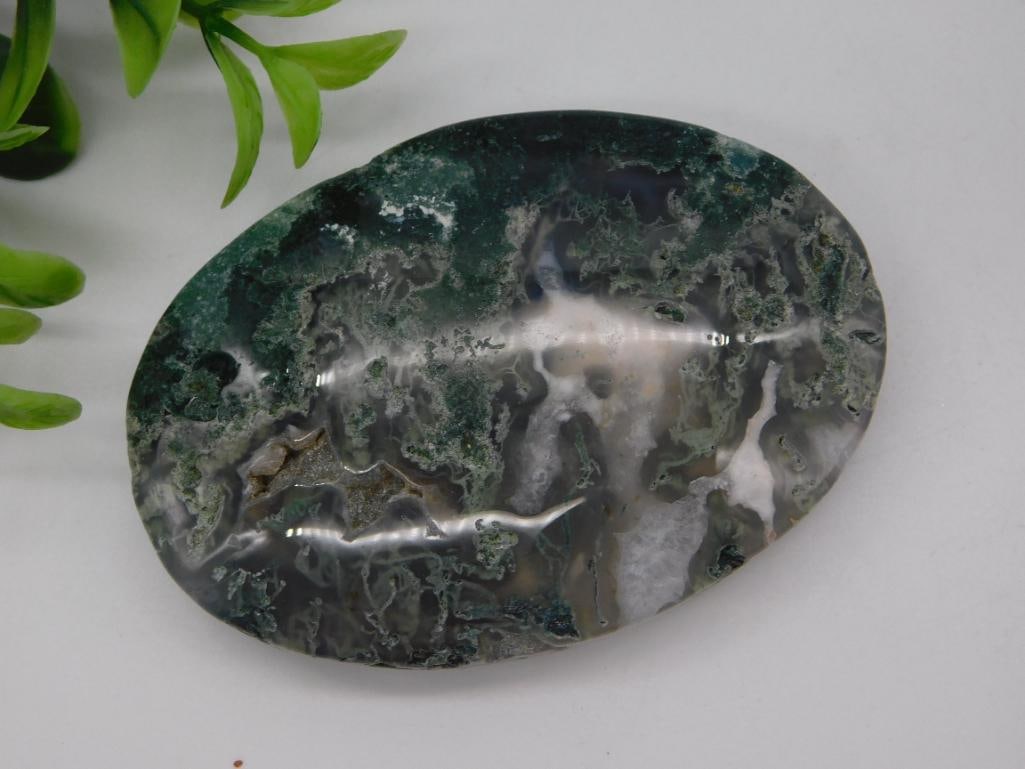 Polished Moss Agate Cabochon Slab (87 grams): Large oval polished moss agate stone displaying dark green dendritic/moss inclusions with gray and white banding, 87 grams.