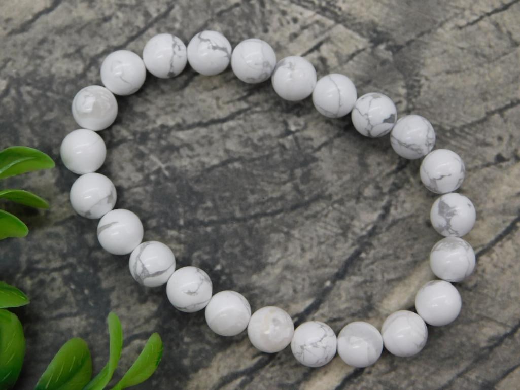 White Howlite Beaded Stretch Bracelet: Beaded stretch bracelet made of round white howlite stone beads with natural gray veining.