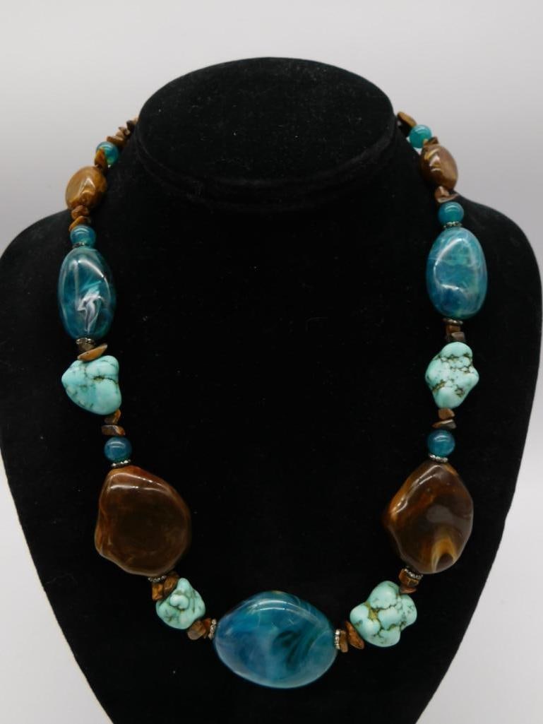 Turquoise, Tiger's Eye, and Agate Statement Necklace: Beaded necklace featuring large polished tiger's eye and blue agate nuggets alternating with turquoise stone accents.