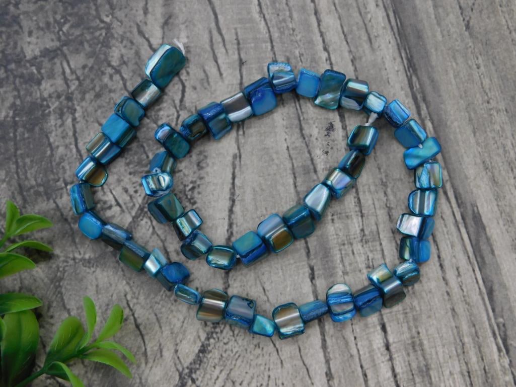 Abalone Shell Nugget Bead Necklace: Long strand necklace of iridescent blue-green abalone shell chip nugget beads.