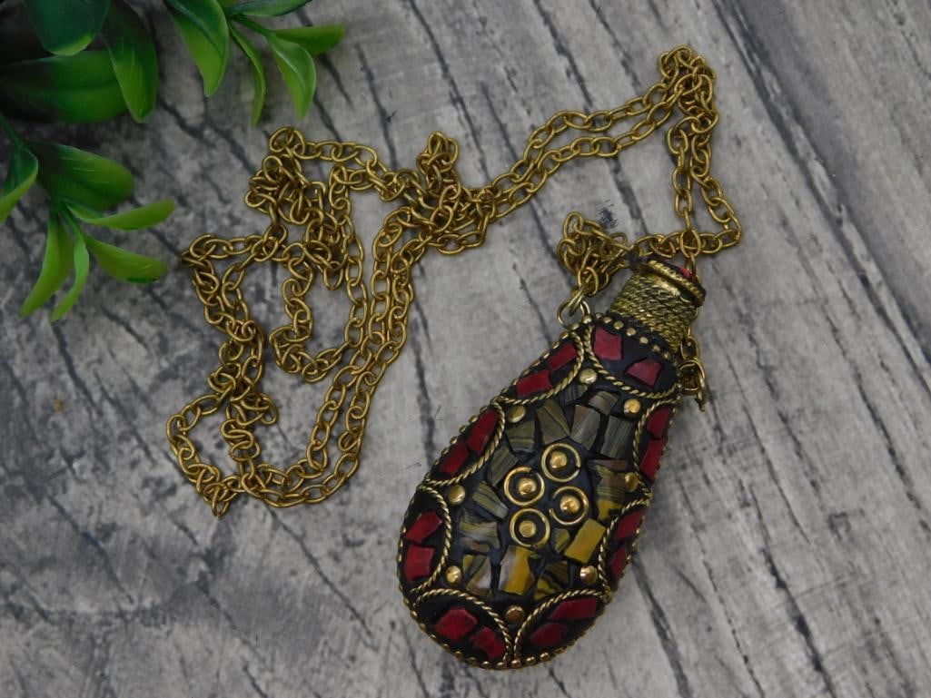 Nepalese Mosaic Inlay Perfume Bottle Pendant Necklace: Brass chain necklace with a teardrop-shaped snuff/perfume bottle pendant decorated with red coral and turquoise mosaic inlay and brass filigree.