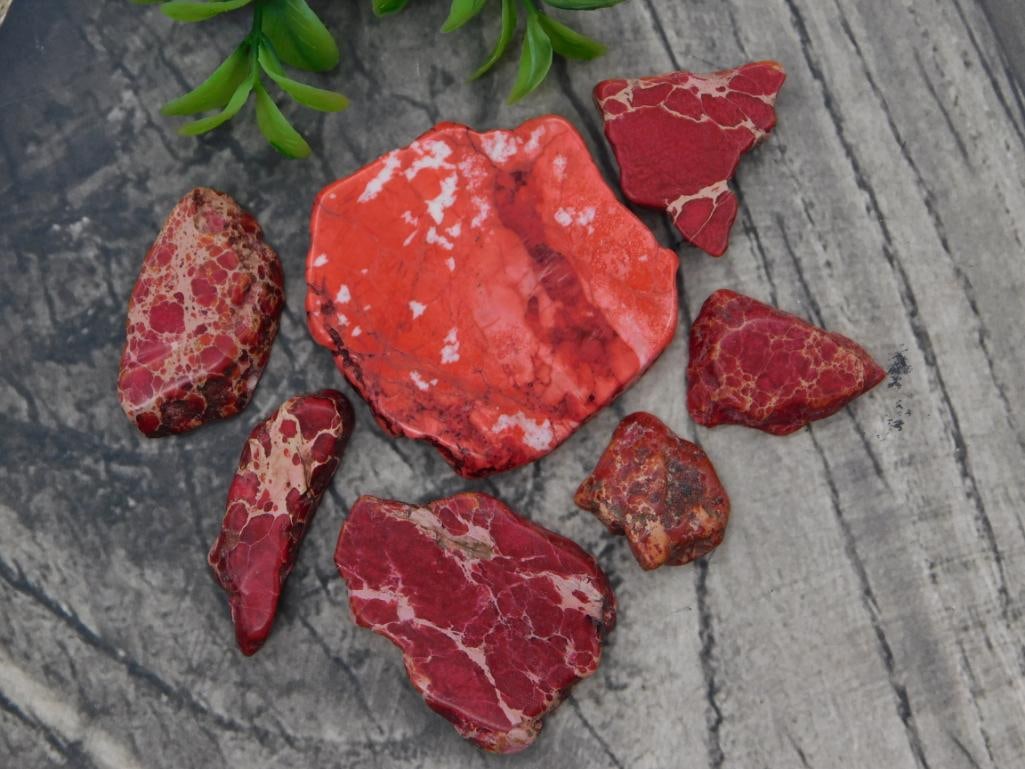 Red Jasper Rough Slab Lot: Group of red jasper rough polished slabs/pieces, various sizes.