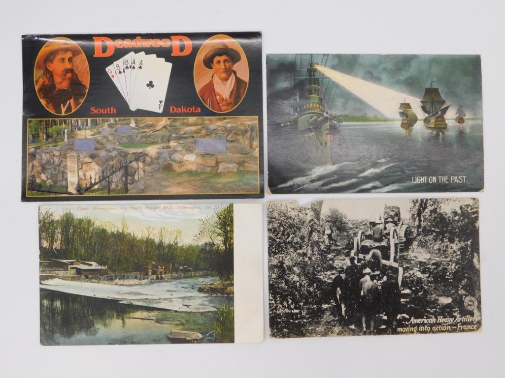 Vintage Postcard Group of Four: Four vintage postcards including a Deadwood South Dakota souvenir card, a naval/ship Light on the Past card, and a WWI American Heavy Artillery photo card.