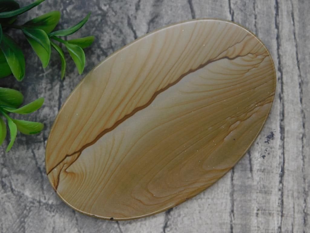 Polished Agate Slice: Oval polished banded agate slab in tan and brown tones.