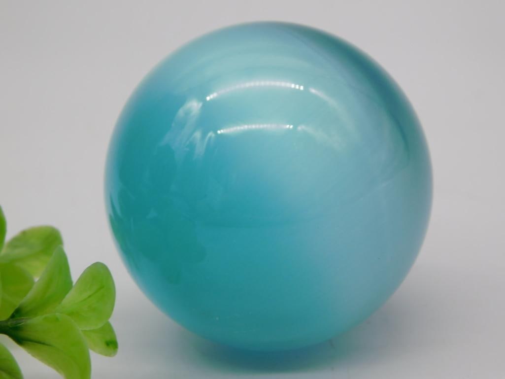 Blue Agate Sphere: Polished blue banded agate sphere/orb on display.