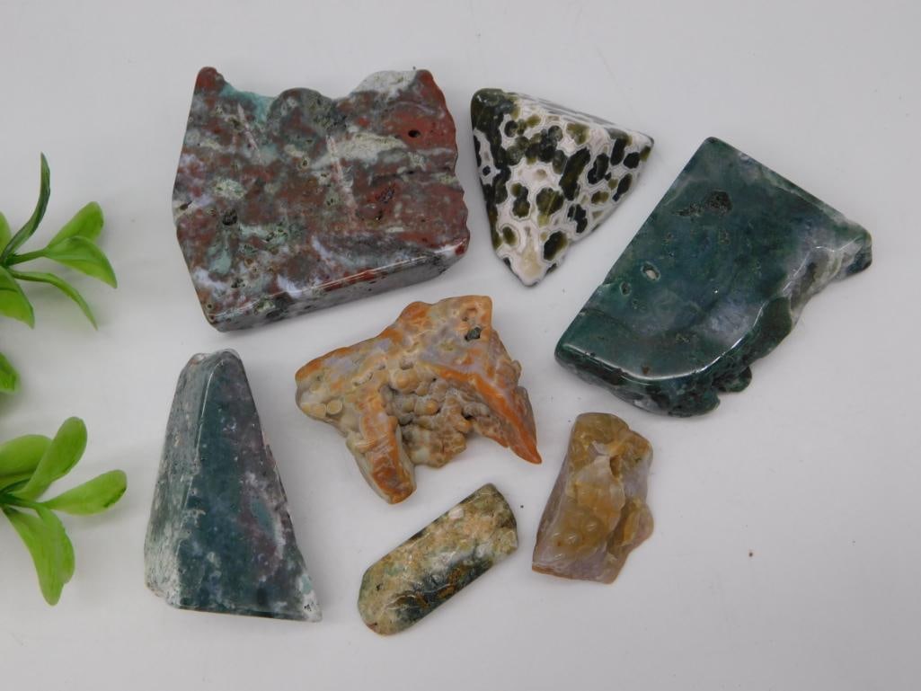 Moss Agate Rough Slab Lot: Assorted polished moss agate and ocean jasper rough slab specimens in green, orange and gray tones.