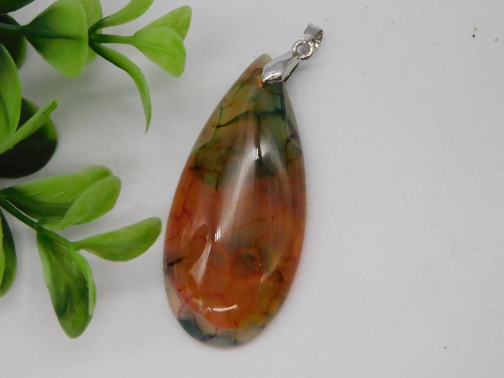 Dragon Vein Agate Pendant: Teardrop-shaped dragon vein agate gemstone pendant with silver-tone bail.