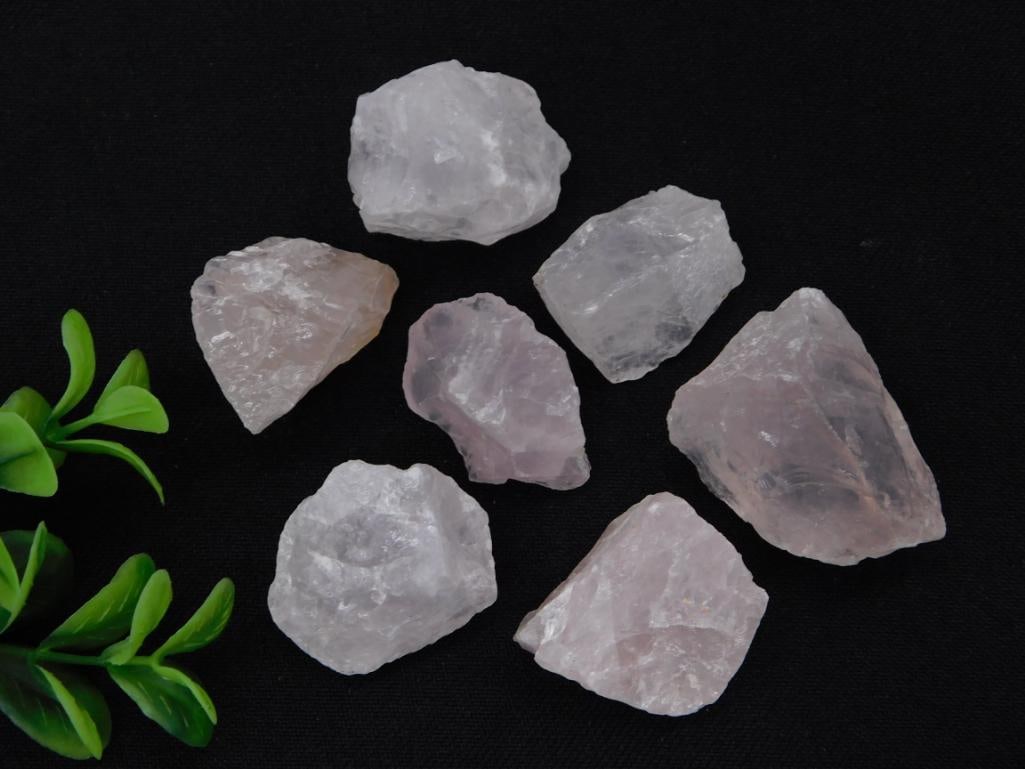 Rose Quartz Rough Specimen Lot: Group of rough polished rose quartz gemstone specimens, pale pink tones.