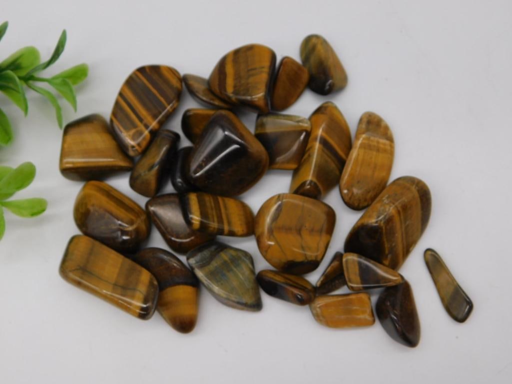 Tiger's Eye Tumbled Stone Lot: Assorted golden brown tiger's eye tumbled gemstone specimens.