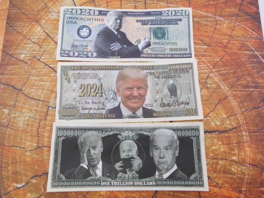 Novelty Political Dollar Bills Lot: Set of three novelty/parody currency notes featuring political figures. Not legal tender.