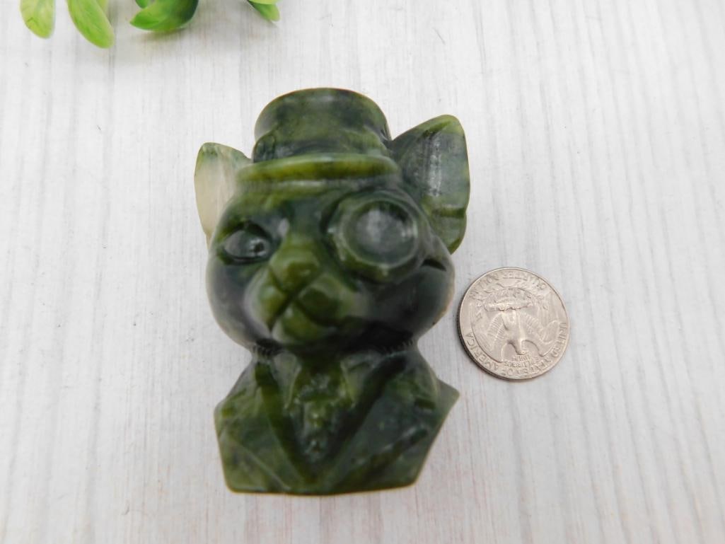 Carved Jade Cat Figurine: Small carved green jade bust figurine of a cat wearing a top hat and monocle.