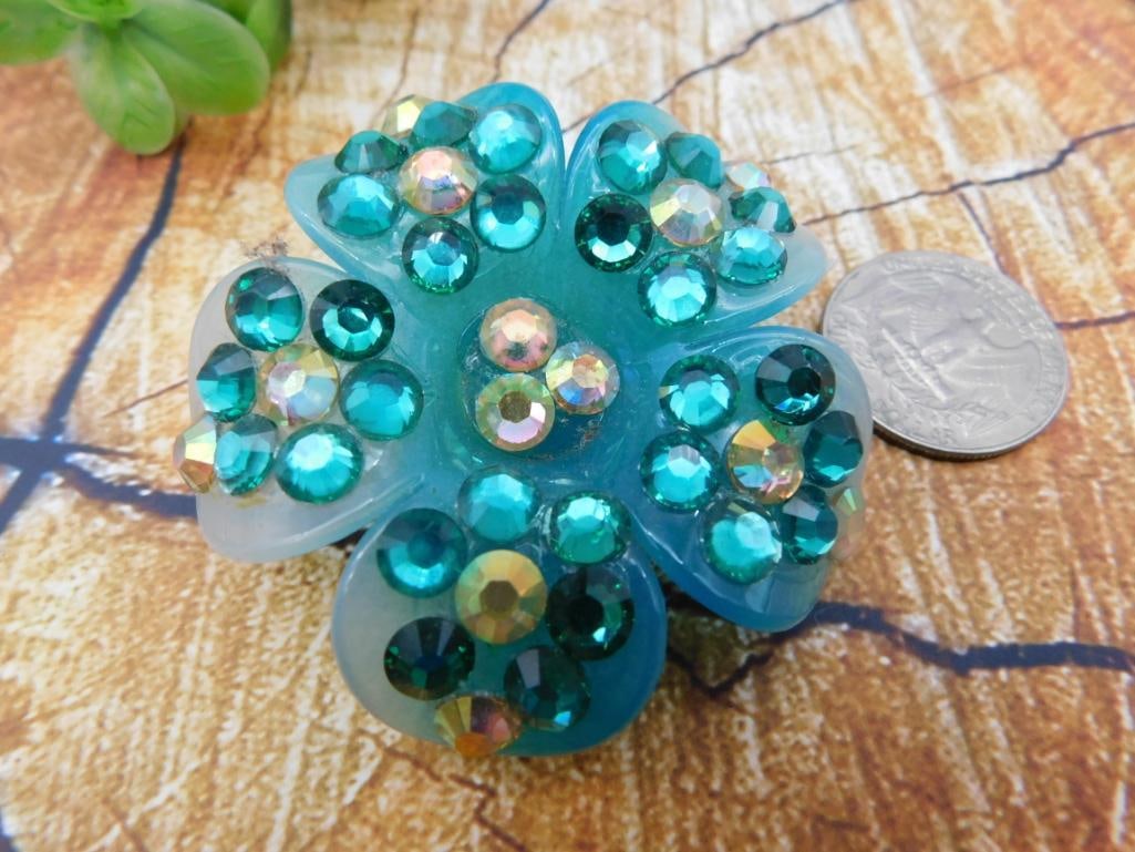 Rhinestone Flower Brooch/Pin: Sparkling teal and iridescent rhinestone flower-shaped brooch.