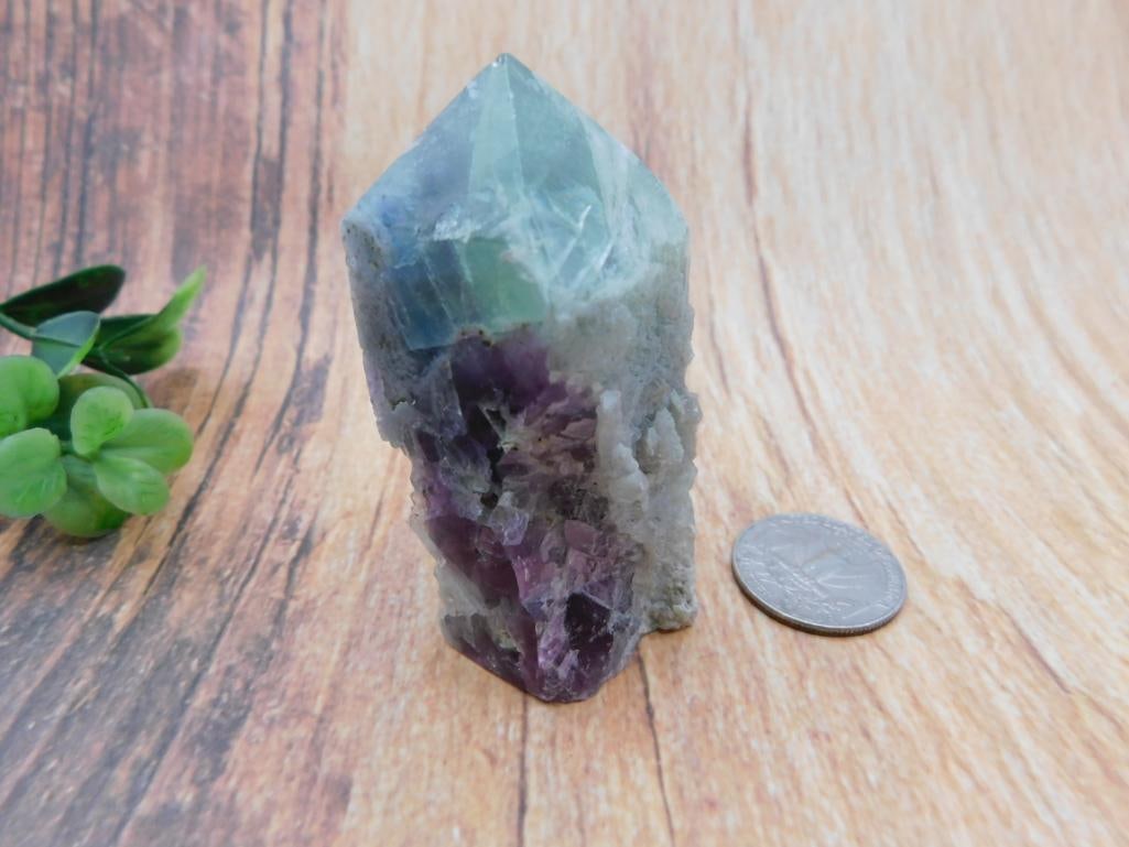 Fluorite Crystal Point: Natural blue and purple fluorite crystal point on matrix base.