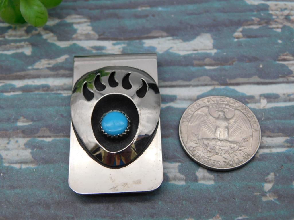 Bear Paw Turquoise Money Clip: Silver-tone bear paw design money clip set with a round turquoise cabochon.