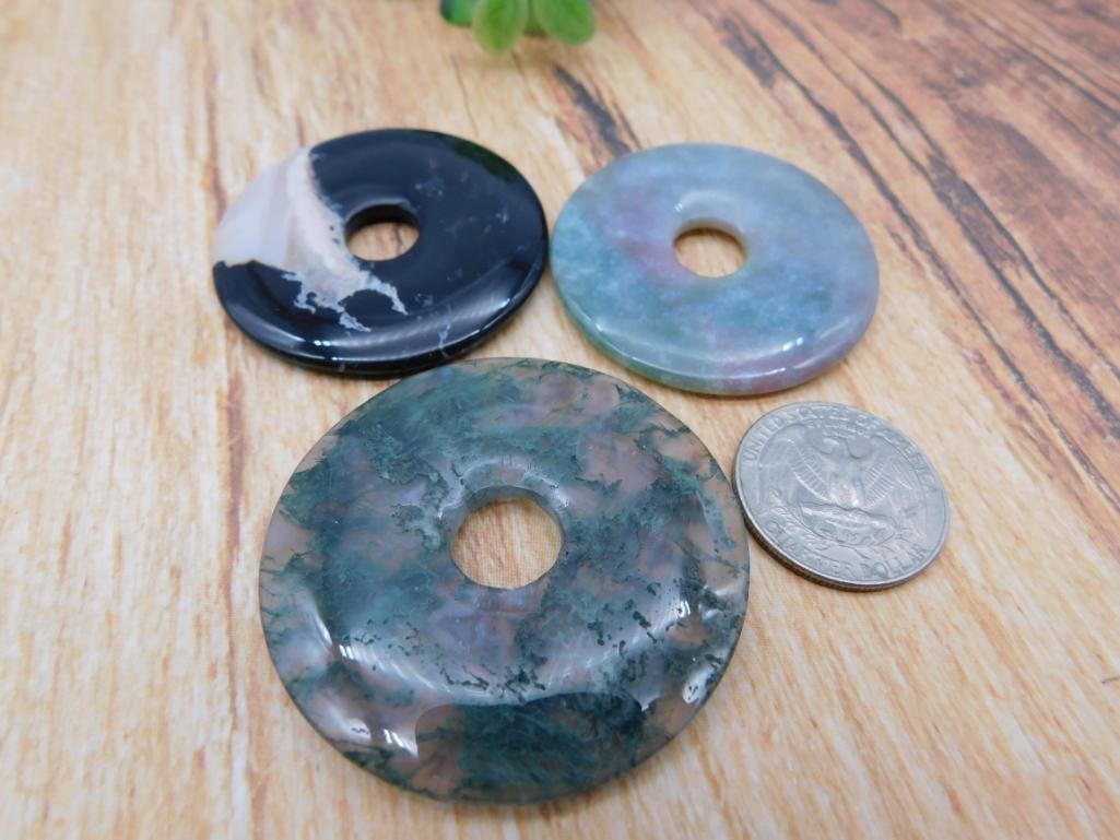 Agate Donut Pendants (Set of 3): Three polished agate donut/disc pendants in black, blue-green, and moss patterns.
