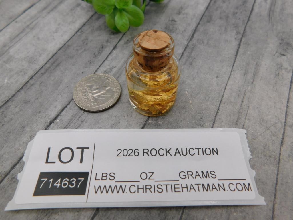 Bottled Gold Flake Mineral Specimen: Small corked glass jar containing decorative gold leaf flakes.