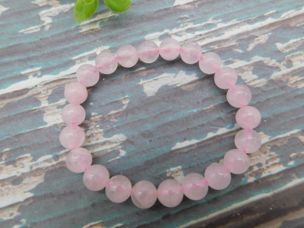 Rose Quartz Beaded Stretch Bracelet: Stretch bracelet of round polished pale pink rose quartz beads.