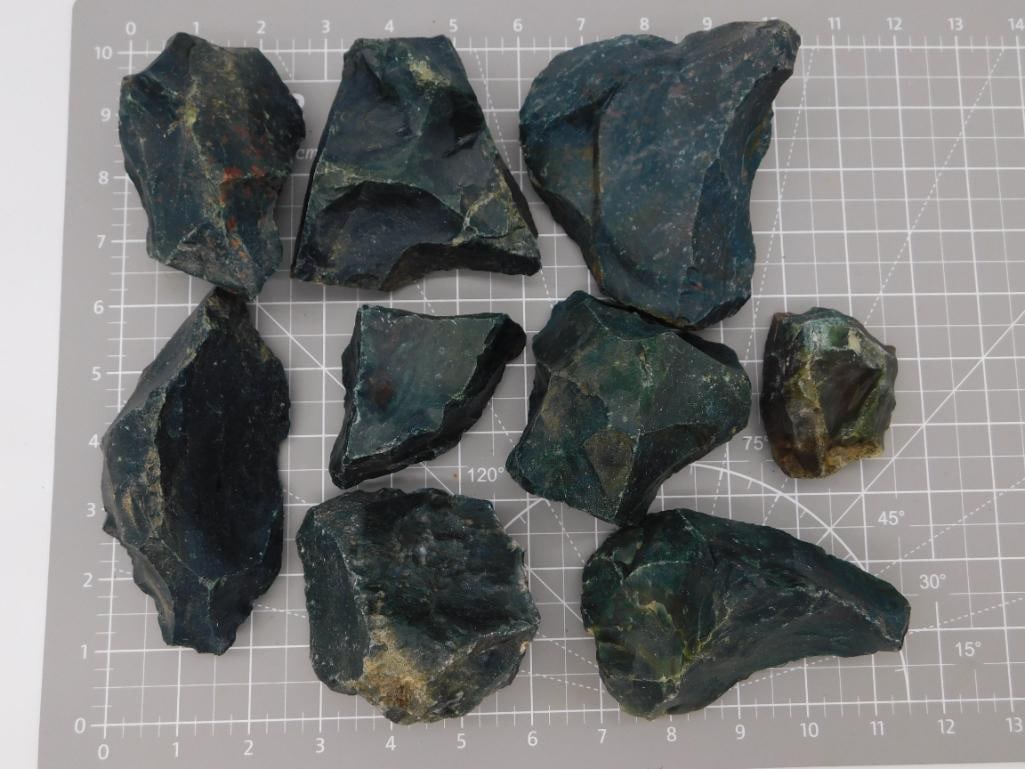 Bloodstone Rough Rock Lot: Nine pieces of rough bloodstone (heliotrope) displaying dark green jasper with characteristic red iron-oxide spotting, weighing 7 lbs 4 oz total. Close-up photos show the polished-quality mottled