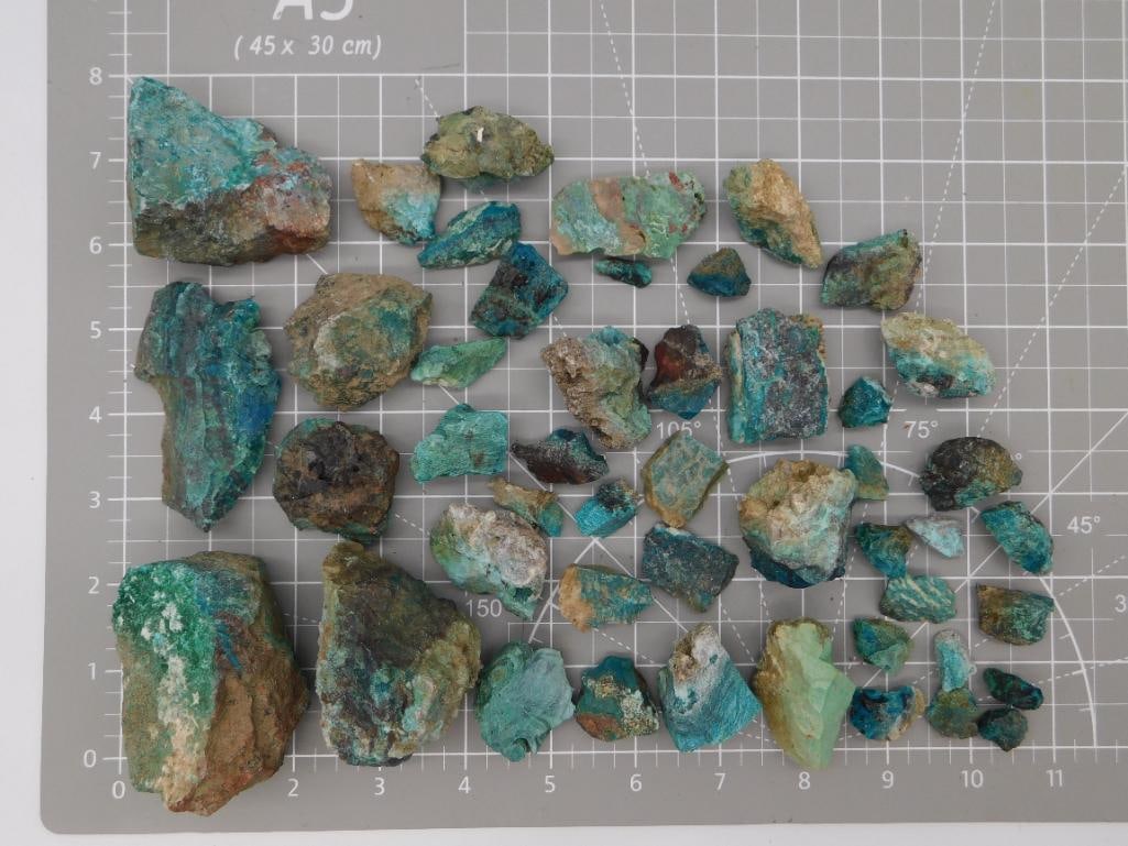 Mineral - Chrysocolla/Malachite Rough Lot: Collection of vivid blue-green chrysocolla and malachite rough specimens with botryoidal and druzy surfaces, some showing associated matrix rock, weighing 2 lbs 2 oz total. Pieces range from about 2