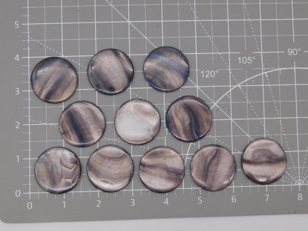 Mother-of-Pearl Shell Cabochon Disc Lot: Set of eleven round mother-of-pearl shell cabochons/discs with natural iridescent brown and cream banding, weighing 85 grams total. Each disc measures approximately 1 inch in diameter and is finished 