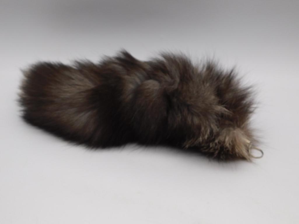 Fur Tail Keychain - Genuine Fur Pom Pom with Silver Key Ring: A genuine dark brown fur tail/pom pendant attached to a silver-tone cone cap with star-cutout tag and split key ring. Measures approximately 9-10 inches long as shown against a ruler.