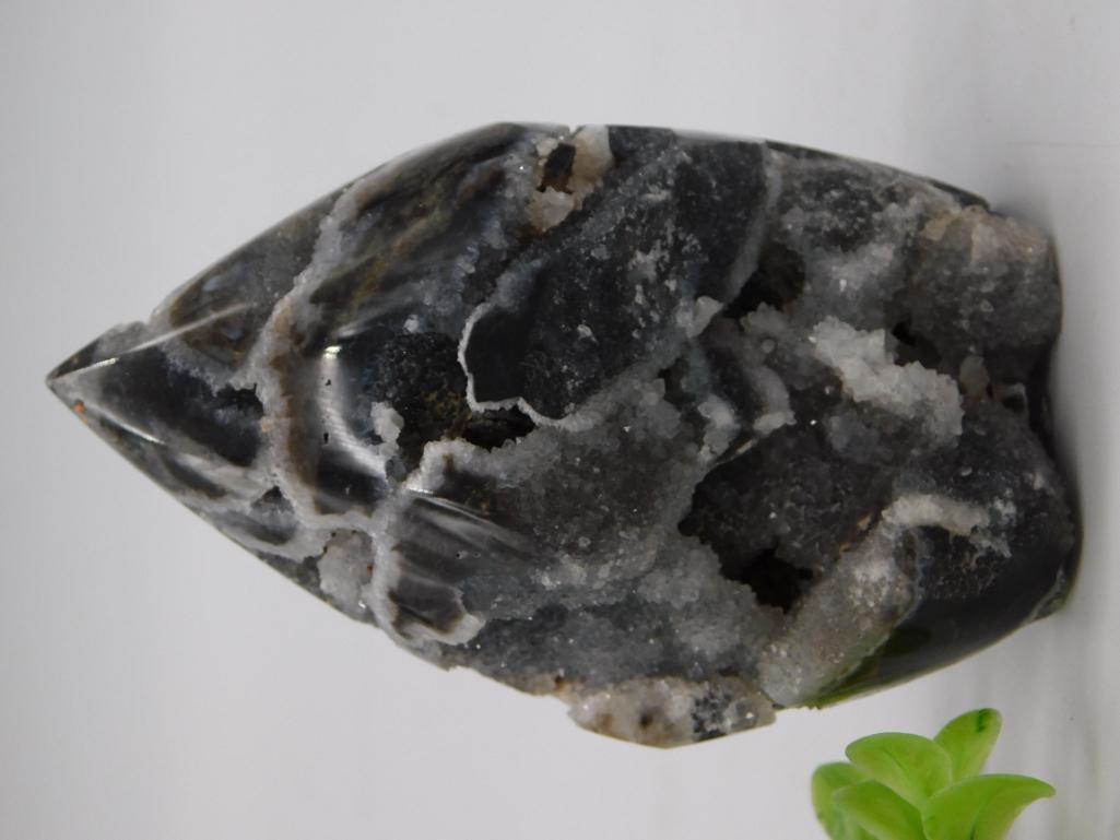 Polished Agate Geode Freeform Rock Specimen with Druzy Crystal Pockets: Freeform polished agate/chalcedony stone in gray and black banded tones with exposed sparkling druzy quartz crystal pockets. Ruler in photo shows the specimen measures approximately 3.5 inches long.