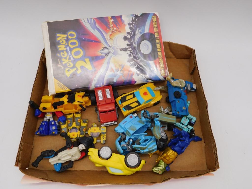Toy Lot - Transformers Style Robots, Cars, and Pokemon VHS (1 of 4)