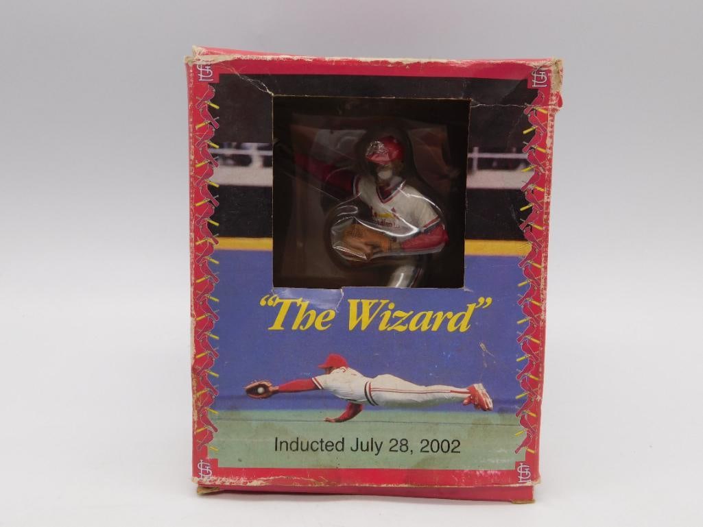 Ozzie Smith Autographed Cardinals "The Wizard" Figurine in Box: A boxed St. Louis Cardinals commemorative figurine of Ozzie Smith titled "The Wizard," marking his July 28, 2002 Hall of Fame induction, showing the figure in diving fielding pose visible through the