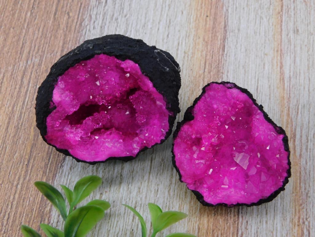 Pink Dyed Agate Geode Pair - 116 Grams Crystal Druzy Halves: A matched pair of dyed magenta-pink agate/quartz geode halves with sparkling druzy crystal interiors and natural dark rough exteriors. Combined weight is 116 grams per the lot tag, with each half meas