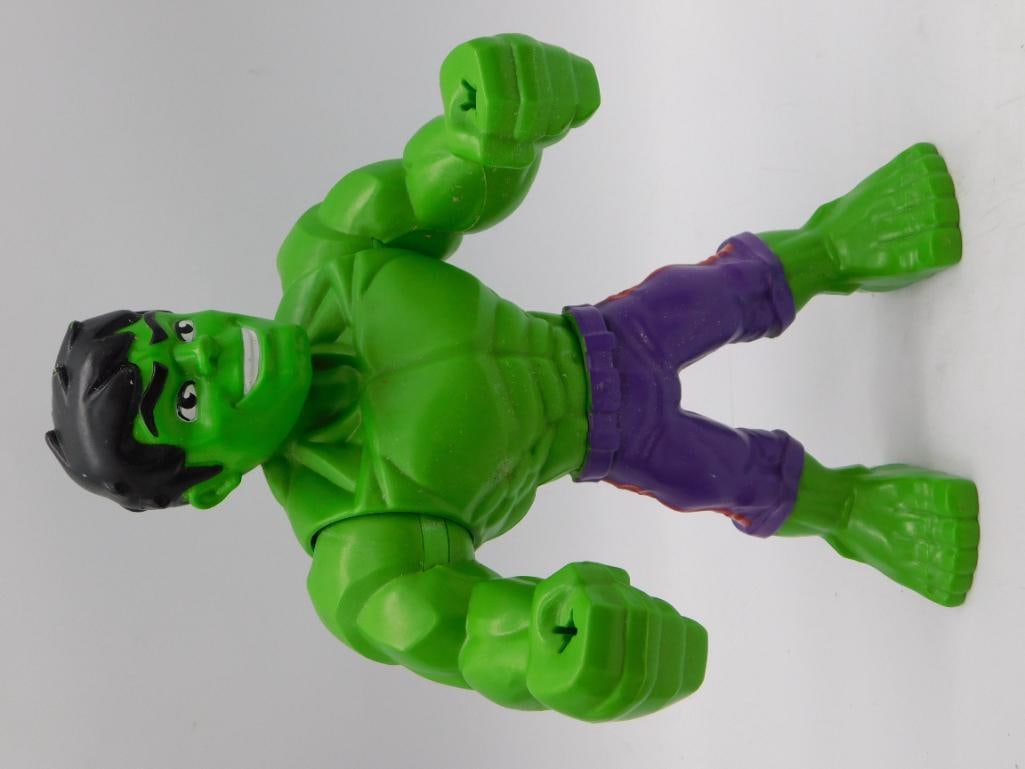 Marvel Hulk Action Figure - 2018 Hasbro Pawtucket Bendable Toy: A green plastic Incredible Hulk action figure with purple shorts, articulated arms and legs, standing approximately 7-8 inches tall as shown against the ruler. Marked on the foot 'TM & ? 2018 Marvel &
