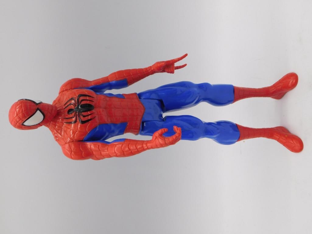 Toy Spider-Man Action Figure, 12-inch: A large red and blue plastic Spider-Man action figure with articulated joints, molded web and spider chest emblem detailing. Marked "Made in China" on the sole of the foot. Figure measures