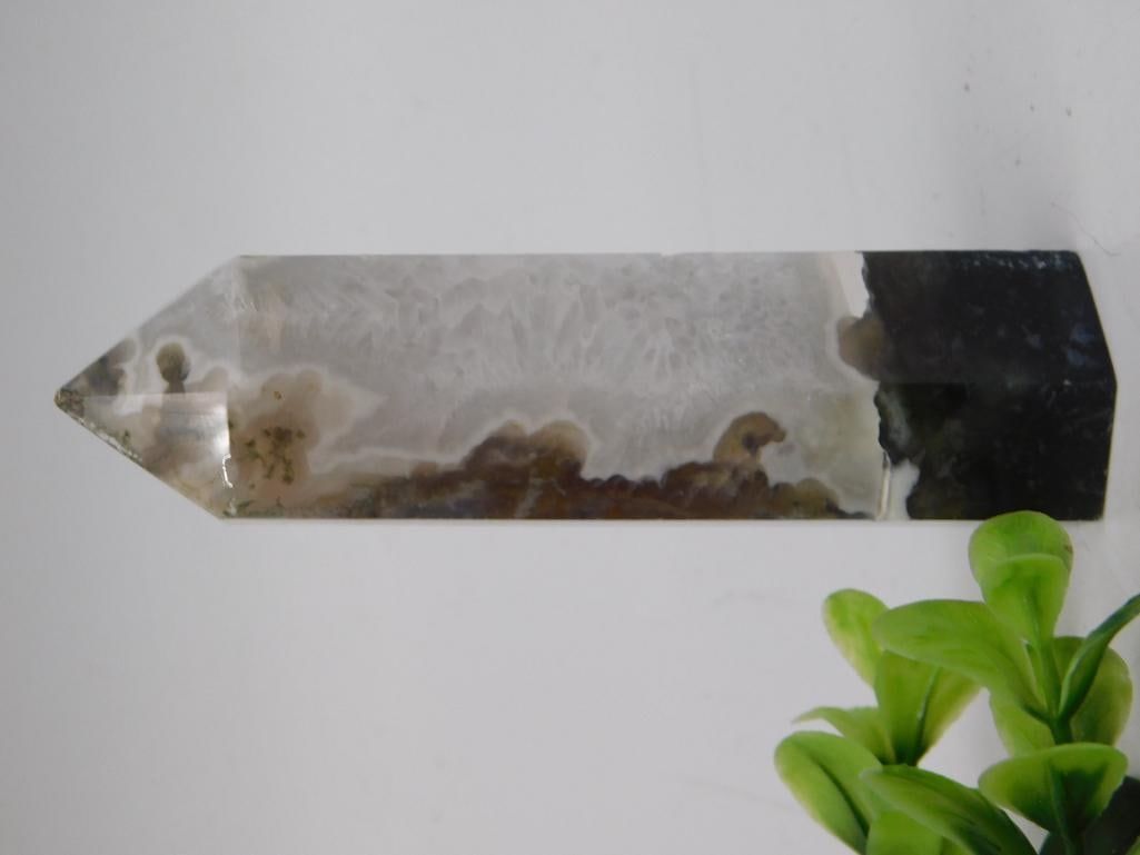 Agate Crystal Point Tower - Polished Banded Mineral Specimen: A polished agate crystal point/obelisk tower showing natural banded gray, white, and moss-green inclusions with a smoky base. Faceted point tip with high polish reveals the stone's translucent quality