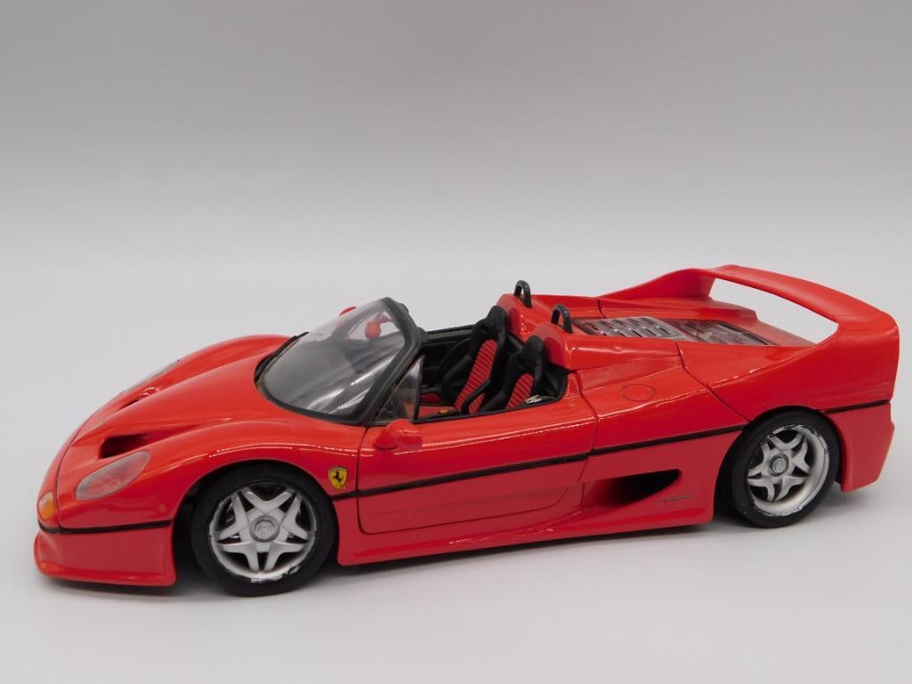 Ferrari F50 Maisto 1:18 Scale Diecast Model Car - Red Convertible: A Maisto 1:18 scale diecast Ferrari F50 in red with removable targa top, opening doors, and detailed engine bay. Ruler photo shows the model measuring approximately 10 inches long; underside is