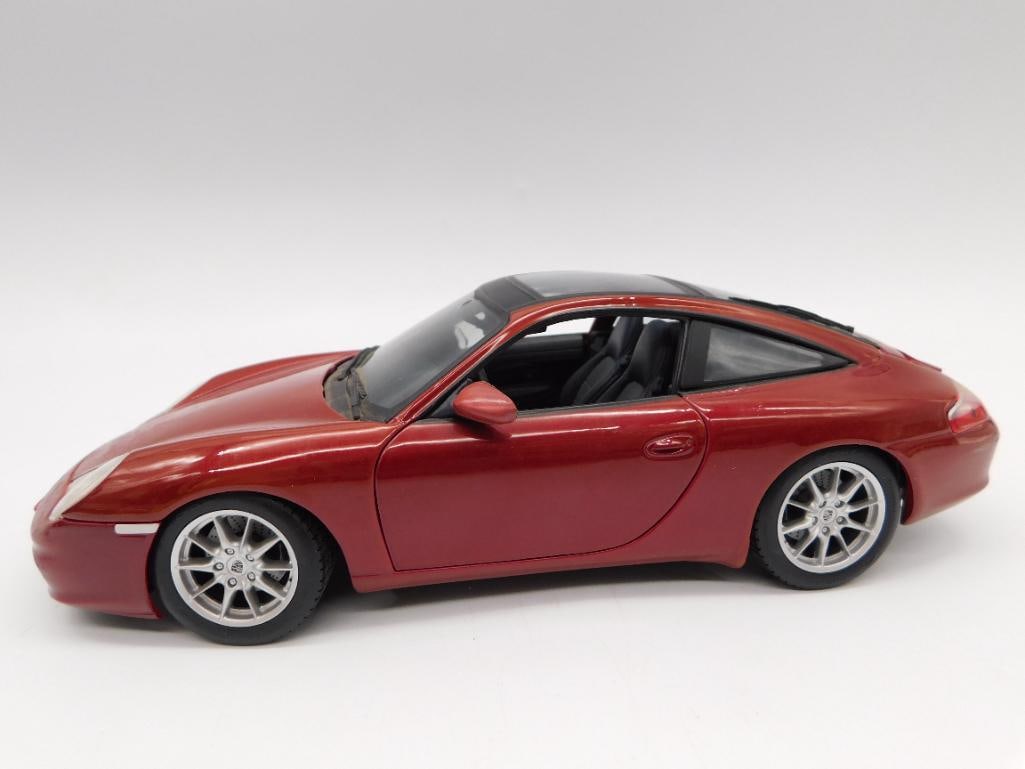 Maisto 1:18 Scale Porsche 911 Targa Diecast Model Car: Red diecast Porsche 911 Targa model with black interior, opening doors and hatch revealing engine detail, alloy-style wheels. Underside marked "Porsche 911 Targa, Scale 1/18, Maisto, Made in