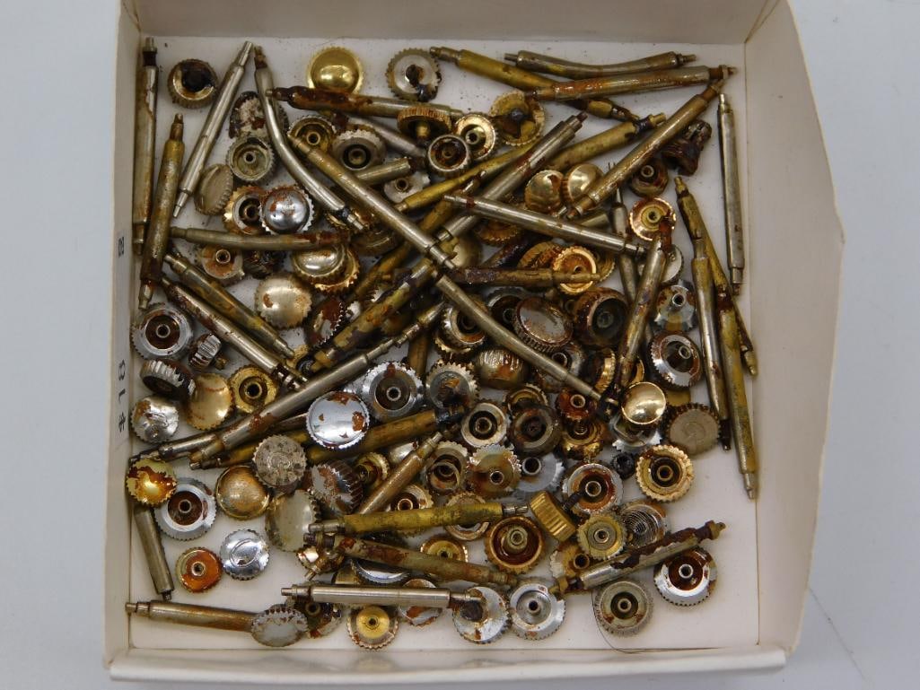 Tool - Large Assortment of Watch Movement Gears and Stems: A dense collection of brass and steel watch movement gears, pinions, and stems.