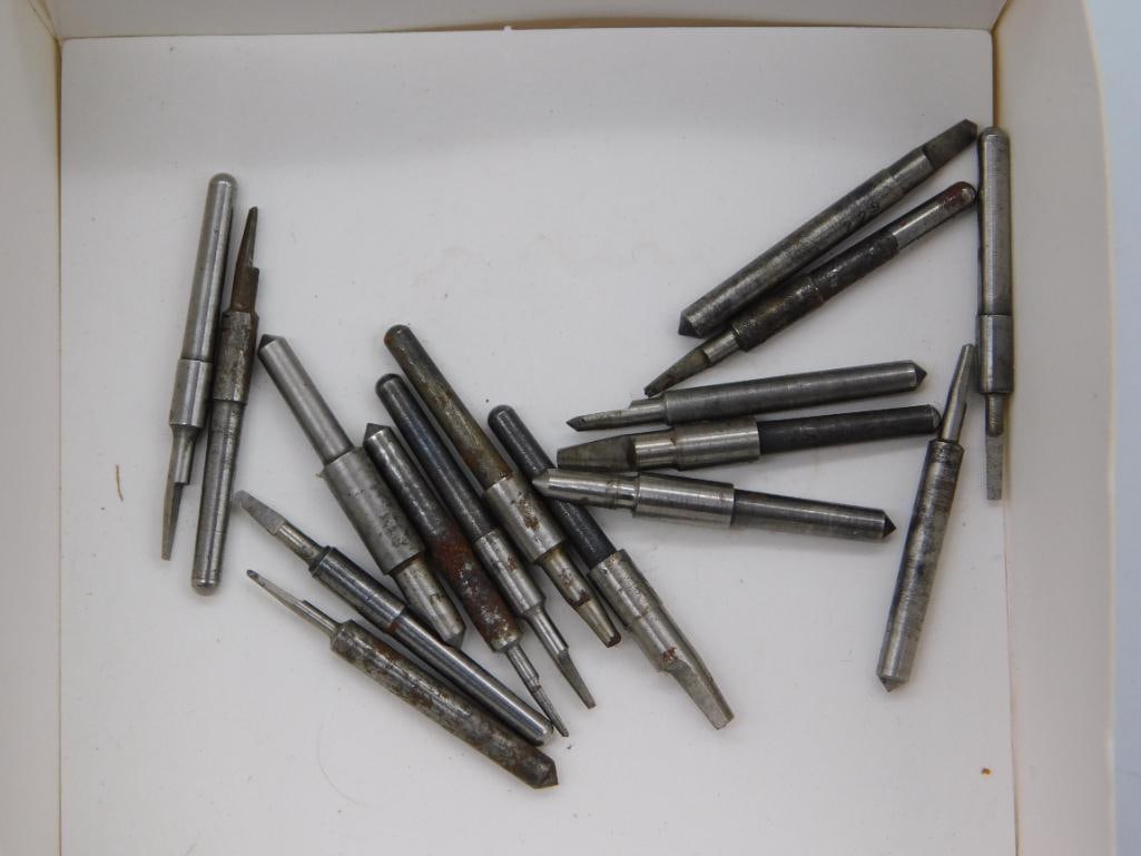 Watchmaker Tool Bit Set - Boxed Graver and Punch Points: A cardboard tray containing about fifteen small steel graver and punch bits with assorted pointed tips. A quarter is included for size reference, showing each bit is roughly one to two inches. Some
