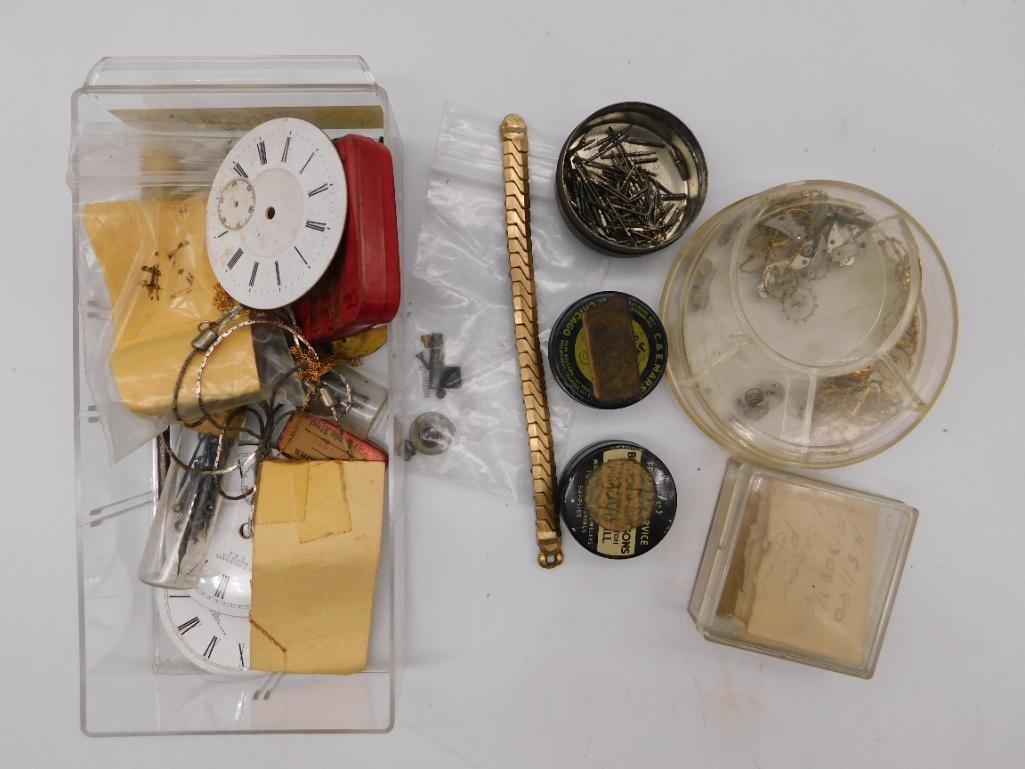 Antique Watchmaker Tool and Parts Collection with Gold-Tone Watch Band: A mixed lot of watchmaker's tools and parts including six steel pivot punches, a plastic parts box with hundreds of small screws and pins, several tins marked with vintage advertising, a clear