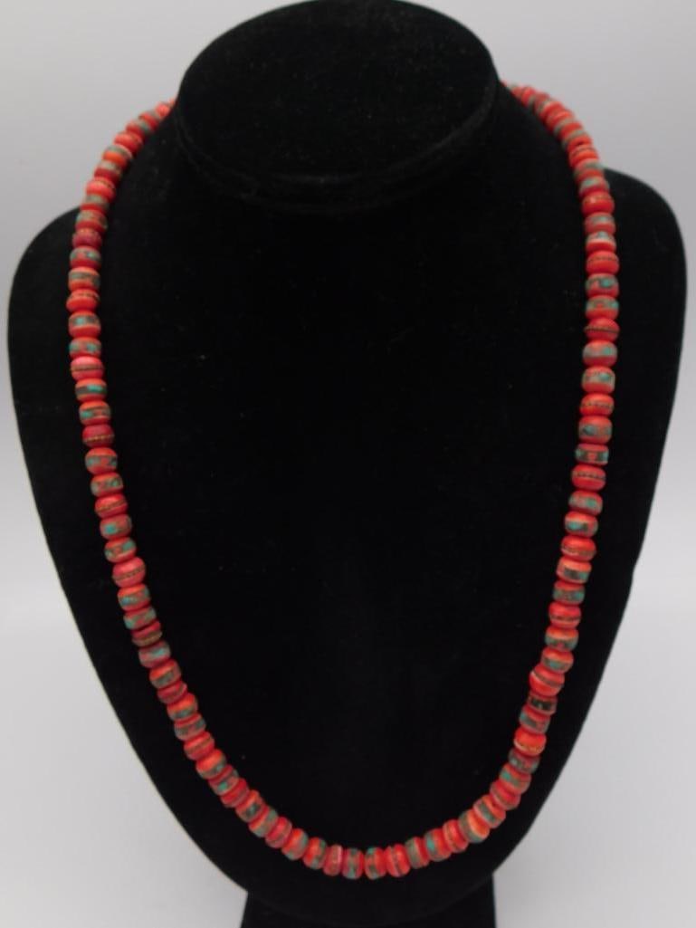 Turquoise-Color Bead Necklace: Long beaded necklace of red/turquoise-hued stone rondelle beads.