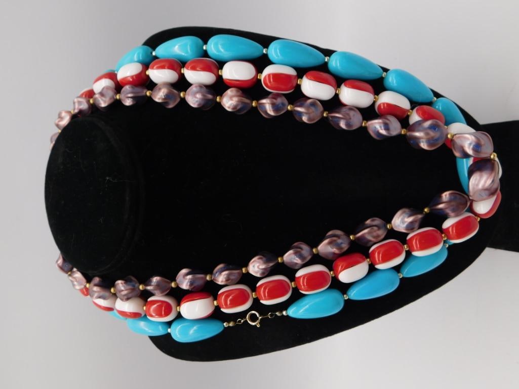 Vintage Glass Bead Necklace, Turquoise Red White & Purple: Double-strand statement necklace of turquoise-blue, red-and-white striped, and iridescent purple glass beads with gold-tone spacer beads. Fastens with a spring-ring clasp. Measures roughly 24-26 inche