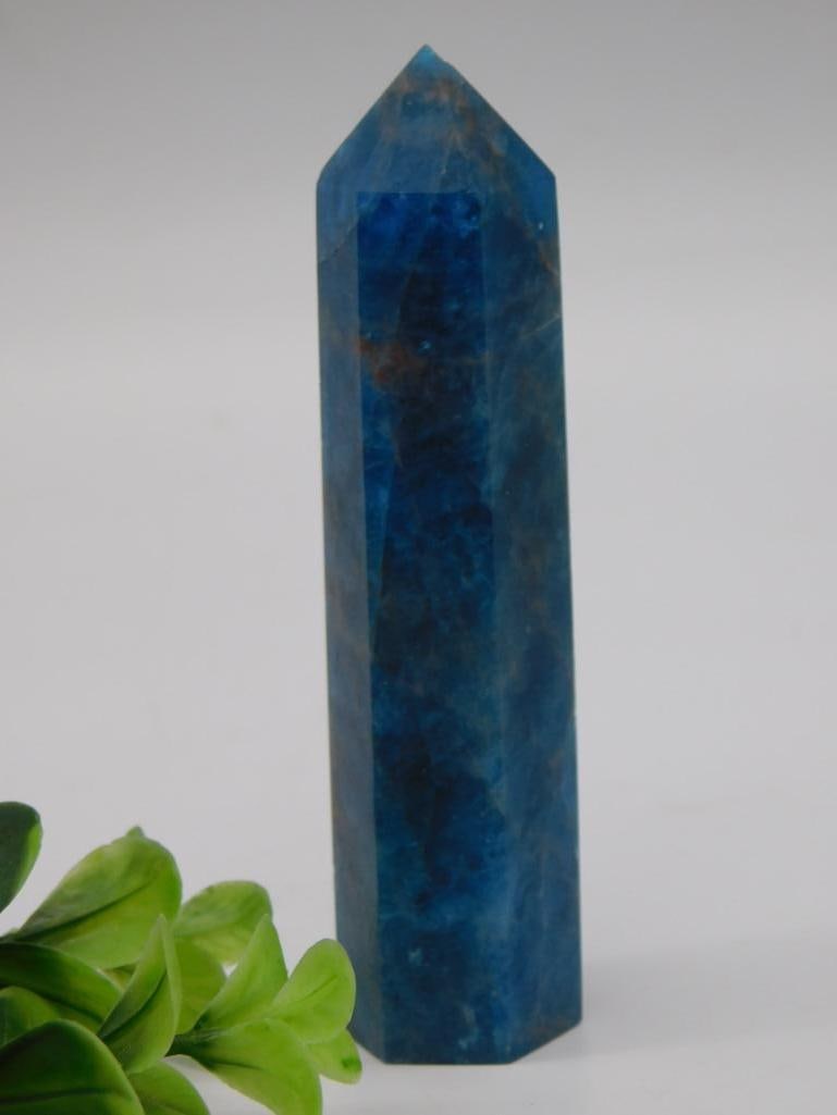 Blue Apatite Crystal Point Tower: A natural blue apatite crystal point tower with translucent banding, polished facets, and a pointed terminus. Approximately 4 inches tall, 107 grams, no visible damage.